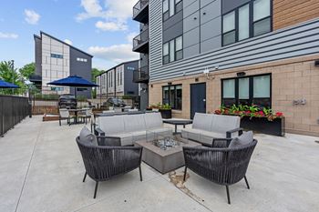 Two outdoor patios with kitchens and firepits
